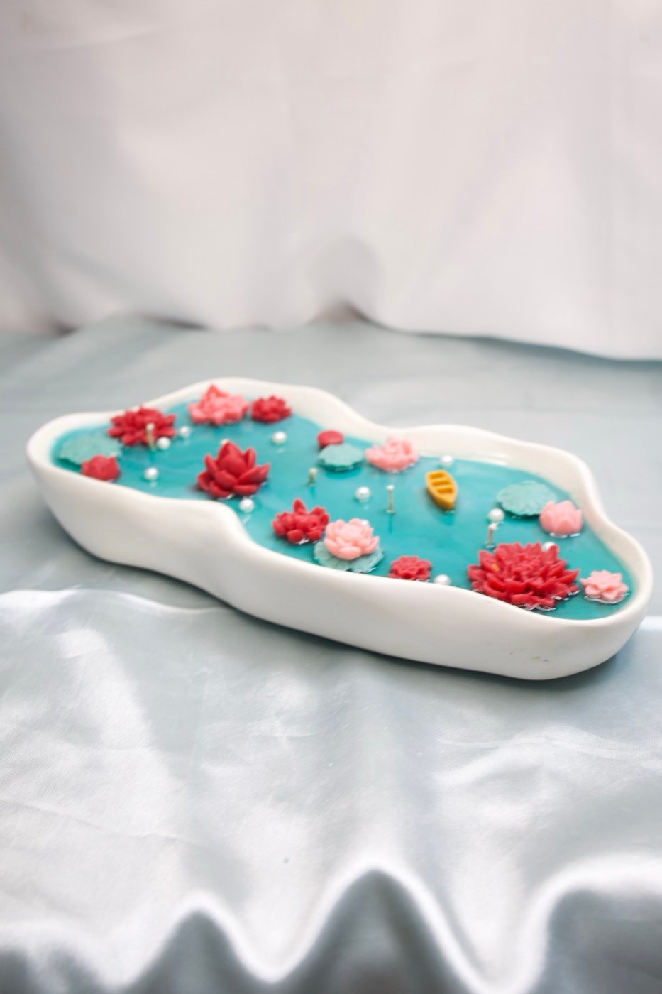 A handcrafted Gaea Scents lotus-pond candle